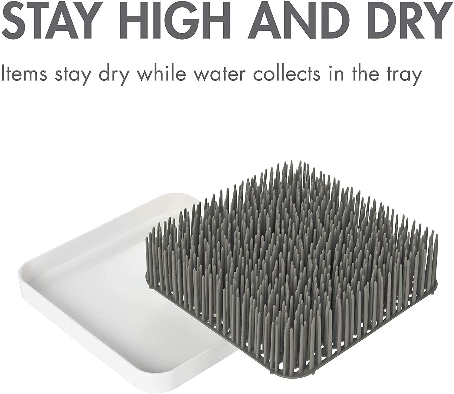 Boon Grass countertop organizer on a kitchen counter