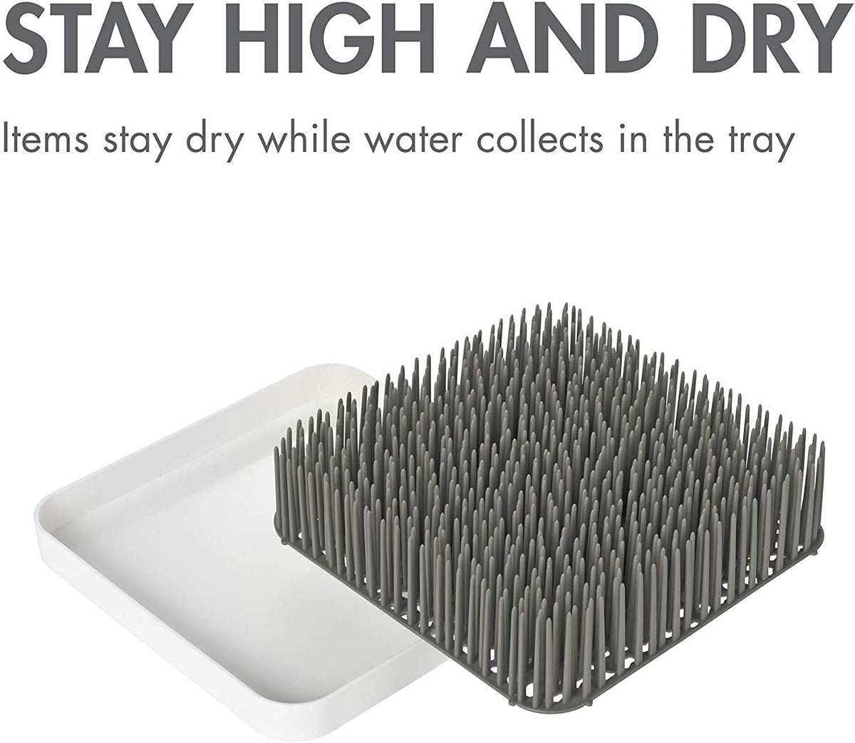 Boon Grass countertop organizer on a kitchen counter
