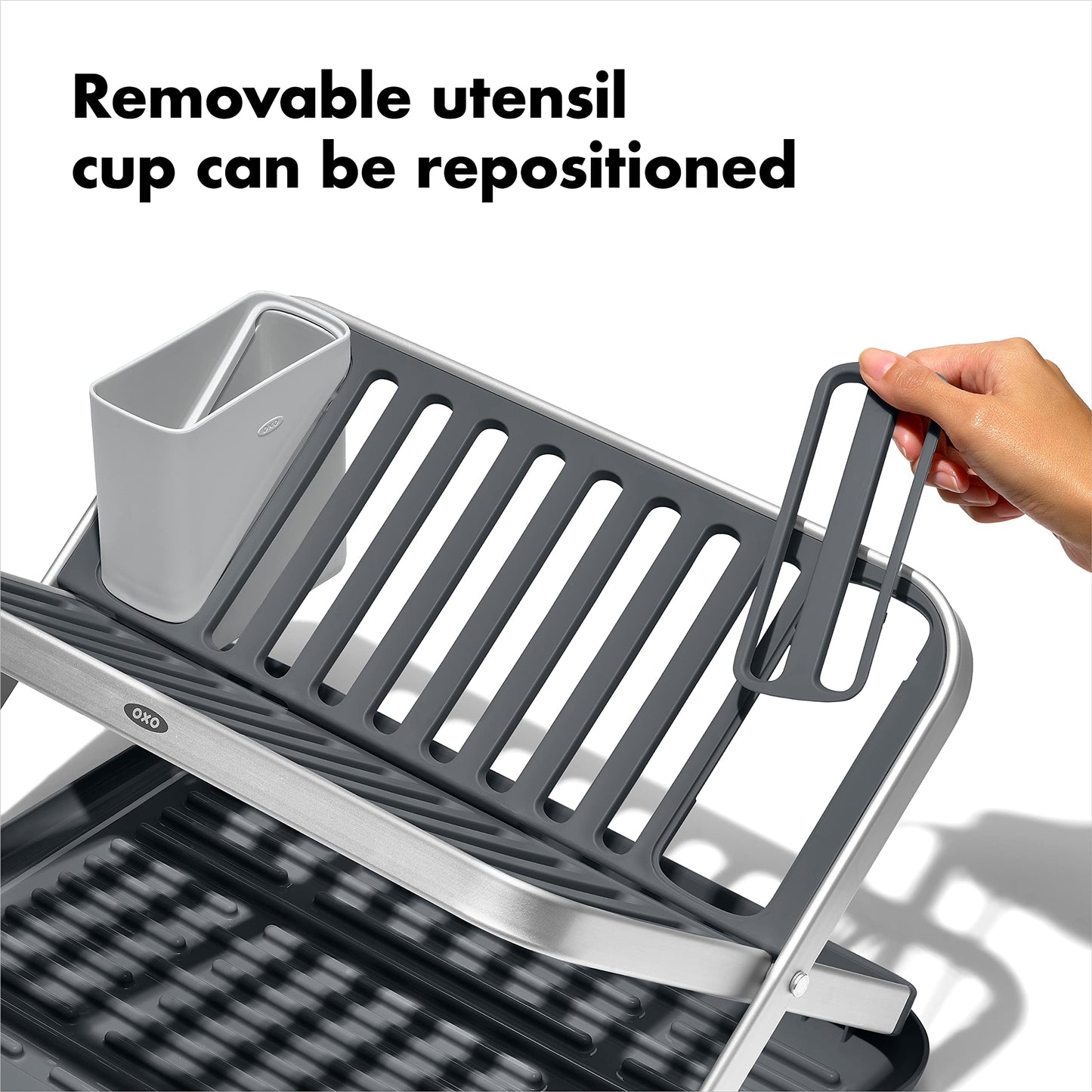 Detailed view of the removable utensil cup attached to the side of the rack