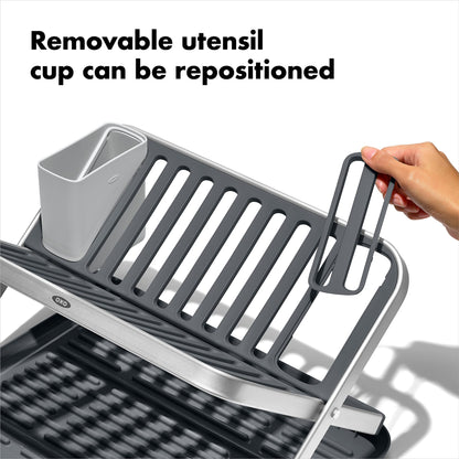 Detailed view of the removable utensil cup attached to the side of the rack