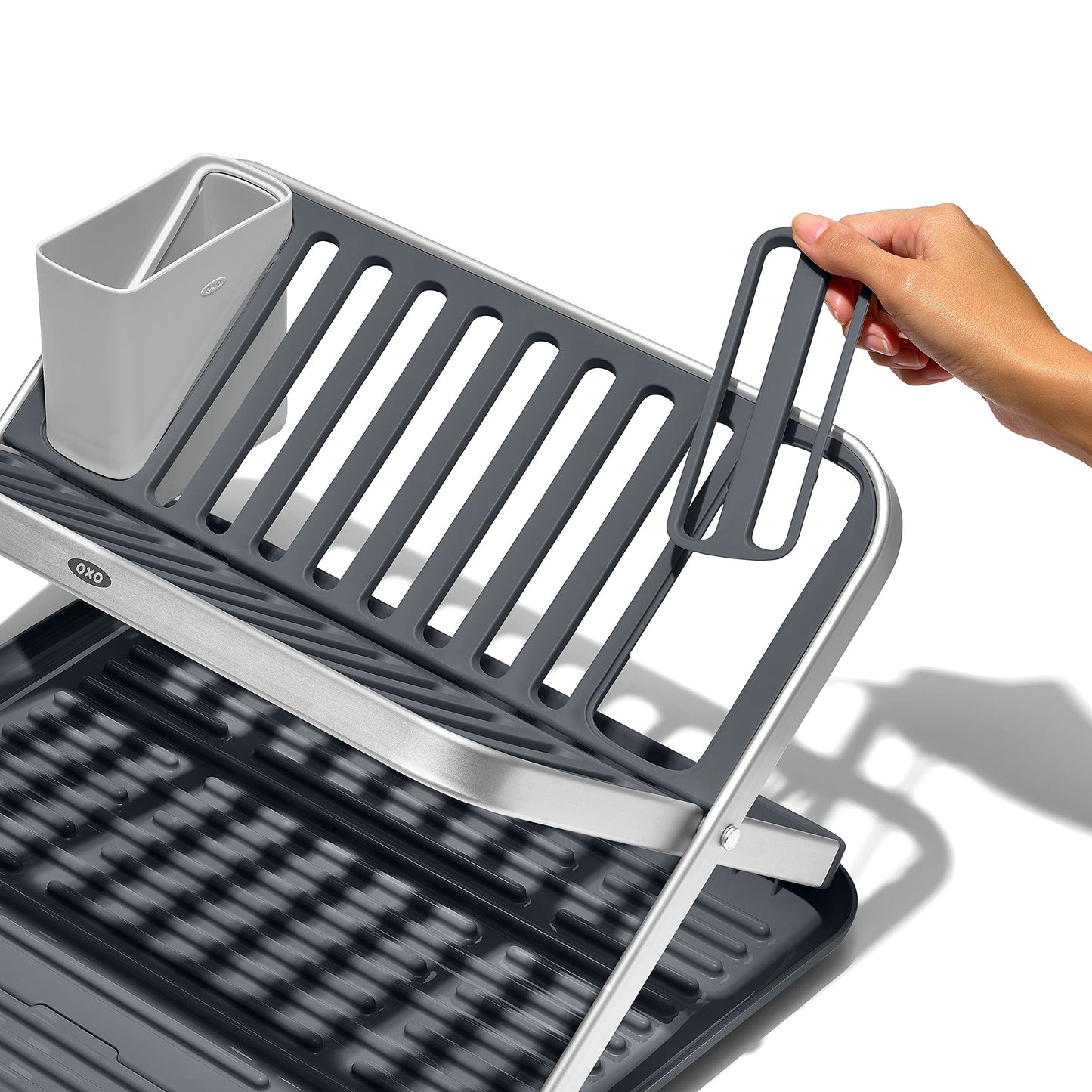 Oxo dish rack in a modern kitchen setup with washed dishes