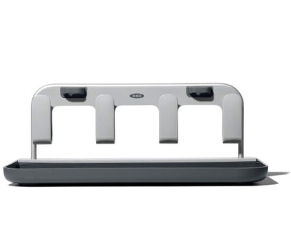 Oxo bottle drying rack holding four water bottles and lids