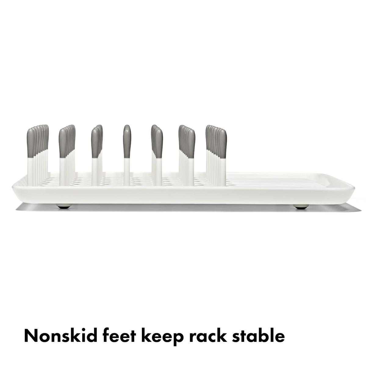 Close up of flexible silicone tipped tines on Oxo Tot rack
