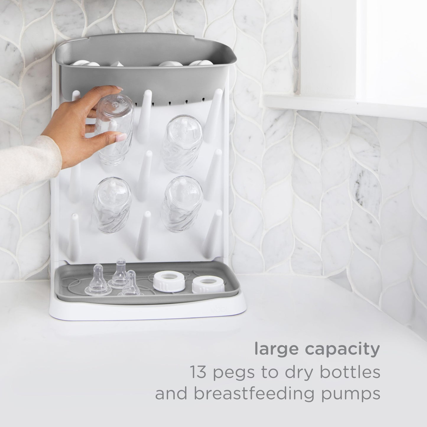 Close up of Ubbi drying rack removable top accessory compartment