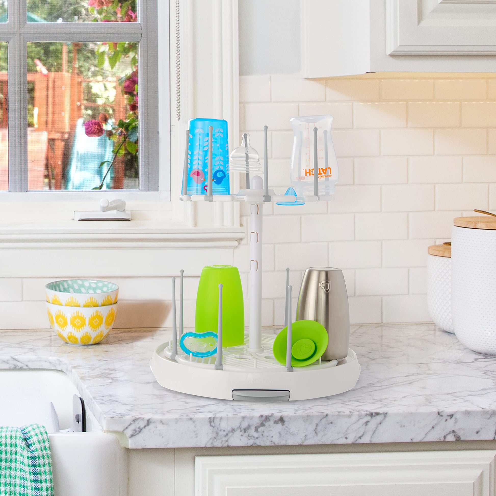 Foldable pegs on Munchkin drying rack for baby accessories
