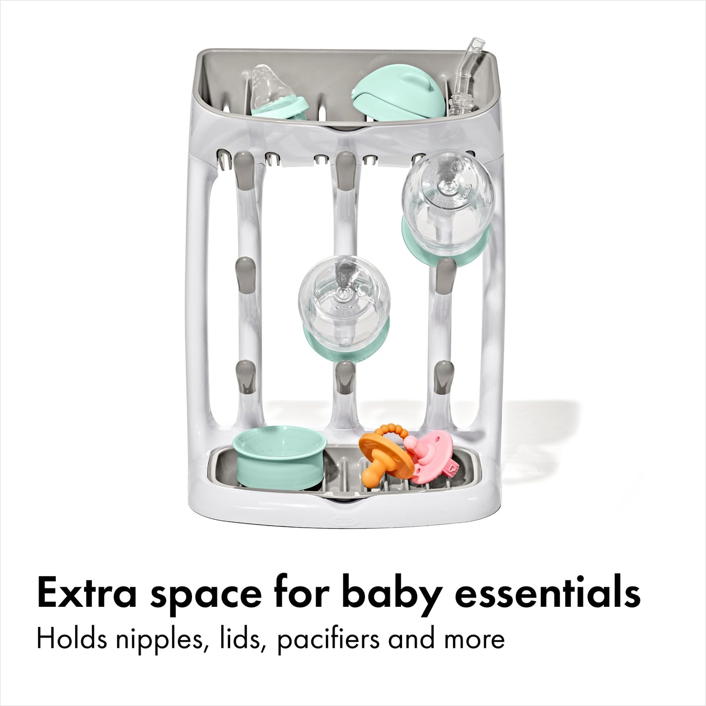 Close up of angled pegs on baby bottle drying rack