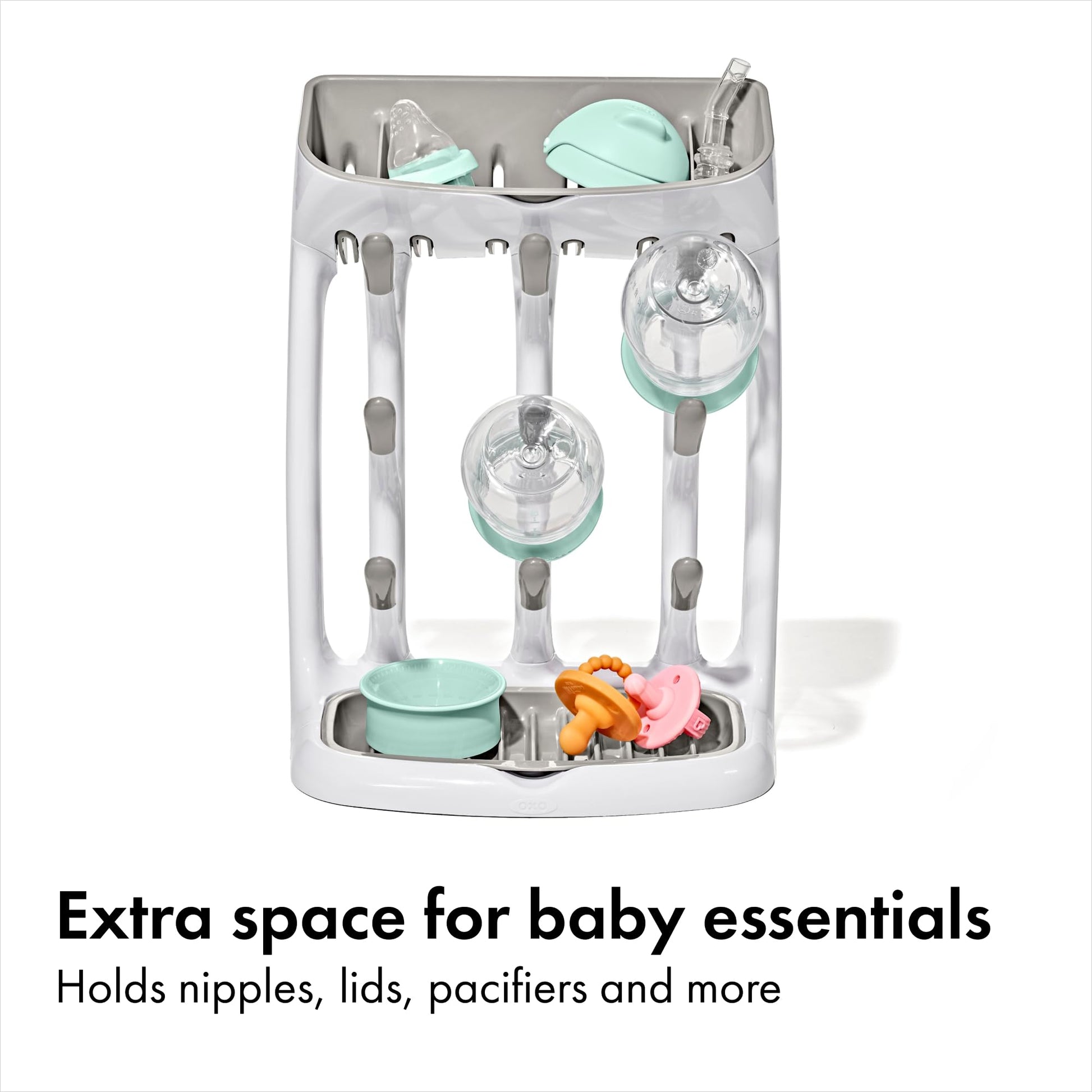 Close up of angled pegs on baby bottle drying rack