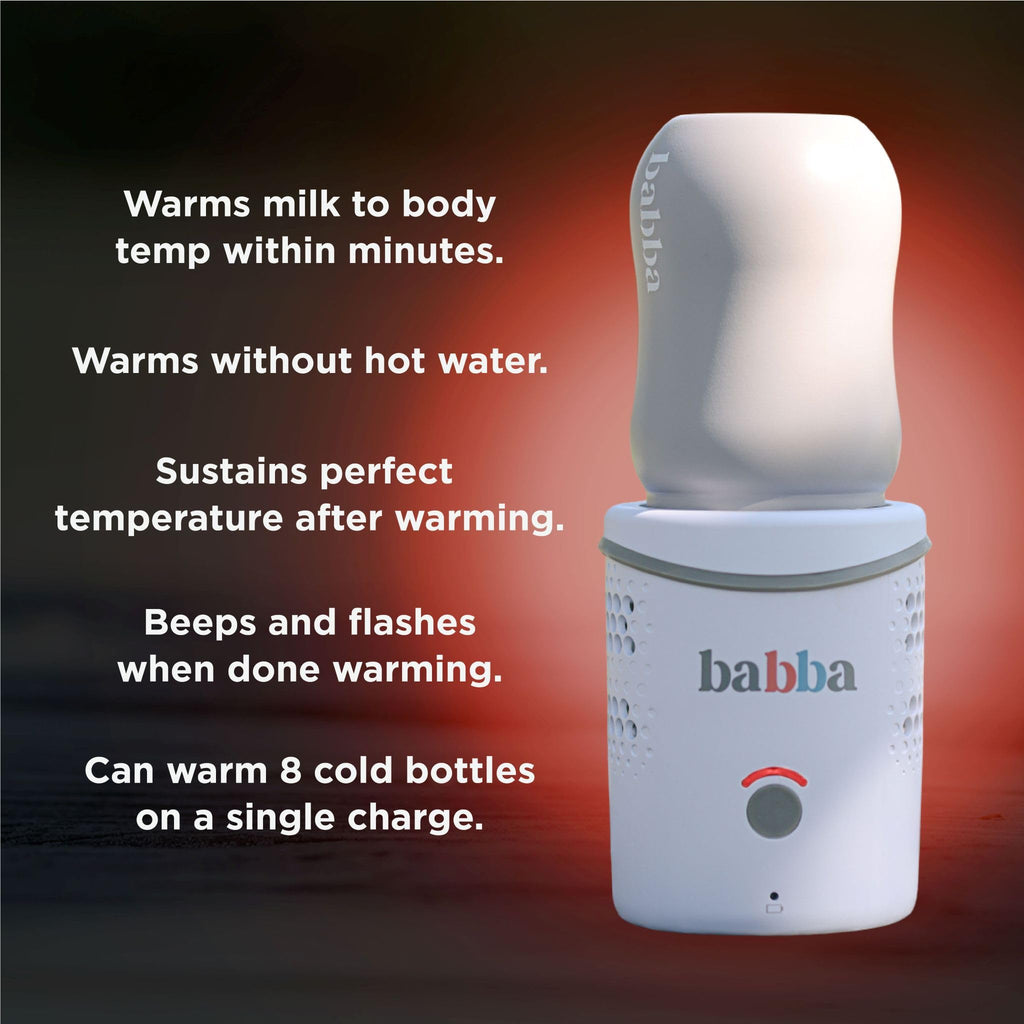 Parents using Babba Care portable bottle warmer during travel