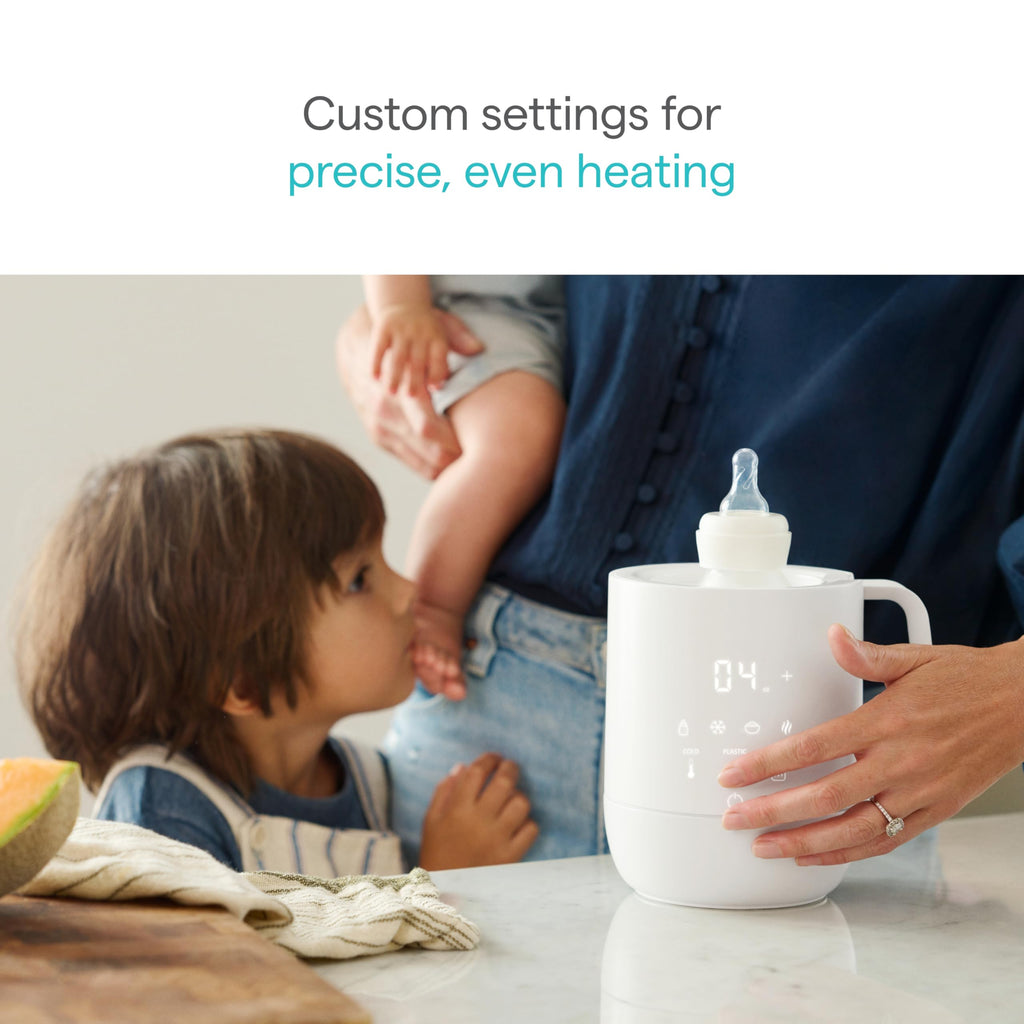 Munchkin bottle warmer with baby bottle inserted
