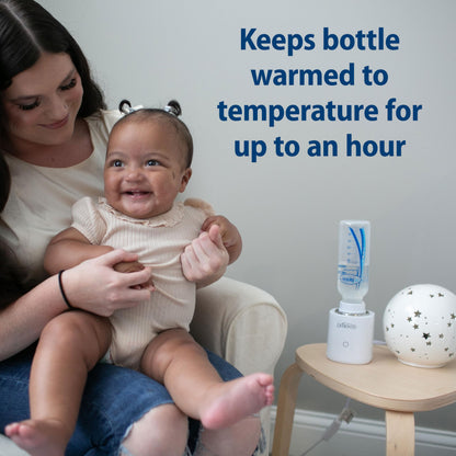 Dr. Brown's travel warmer attached to a wide neck bottle
