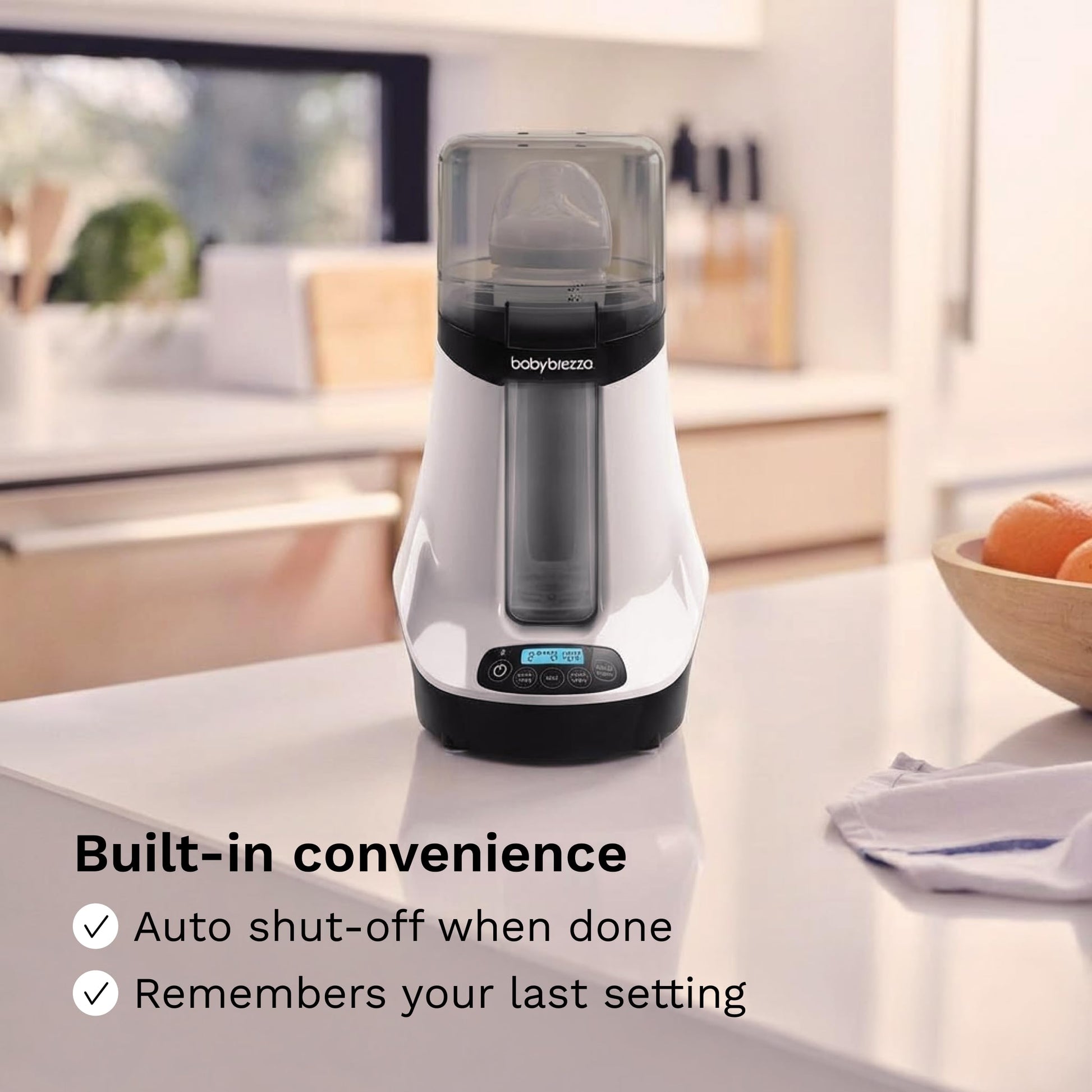 Lifestyle shot of Baby Brezza bottle warmer on a kitchen counter