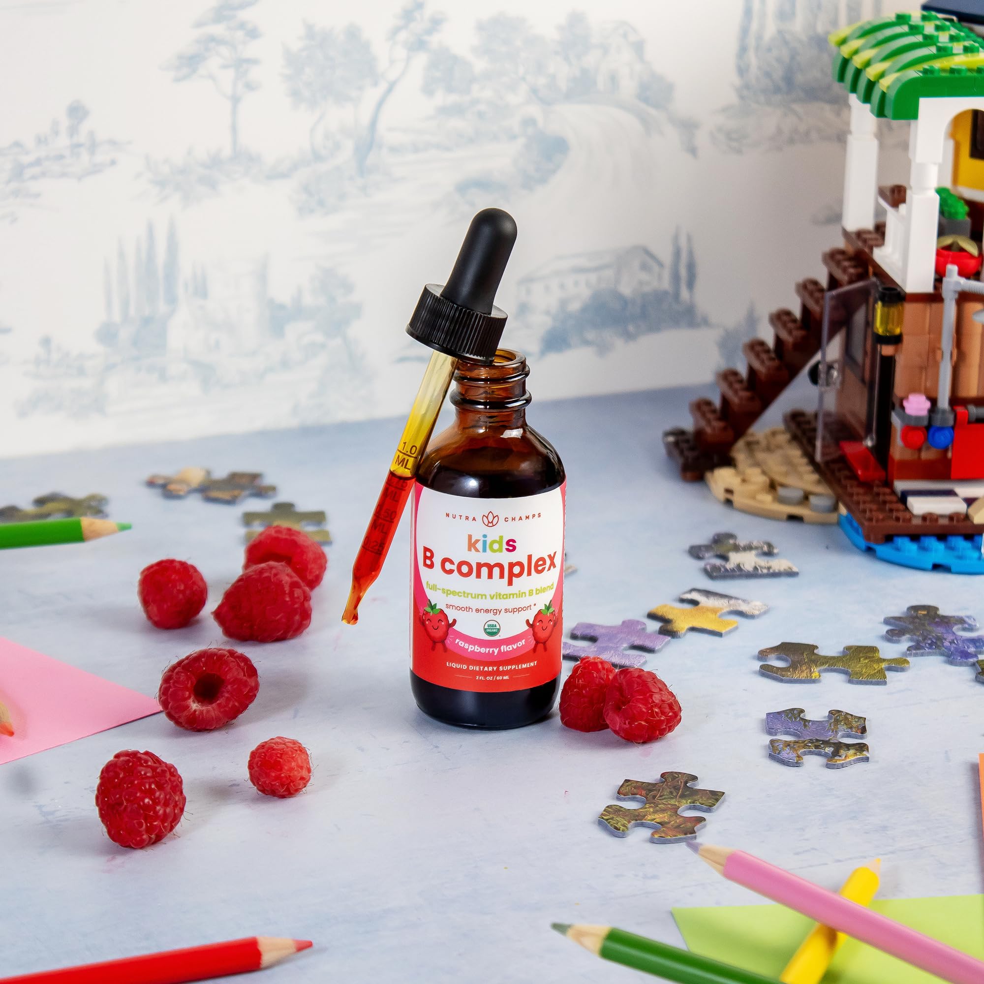NutraChamps Kids B Complex 2 fluid ounce bottle highlighting natural berry flavor and one hundred twenty servings label.