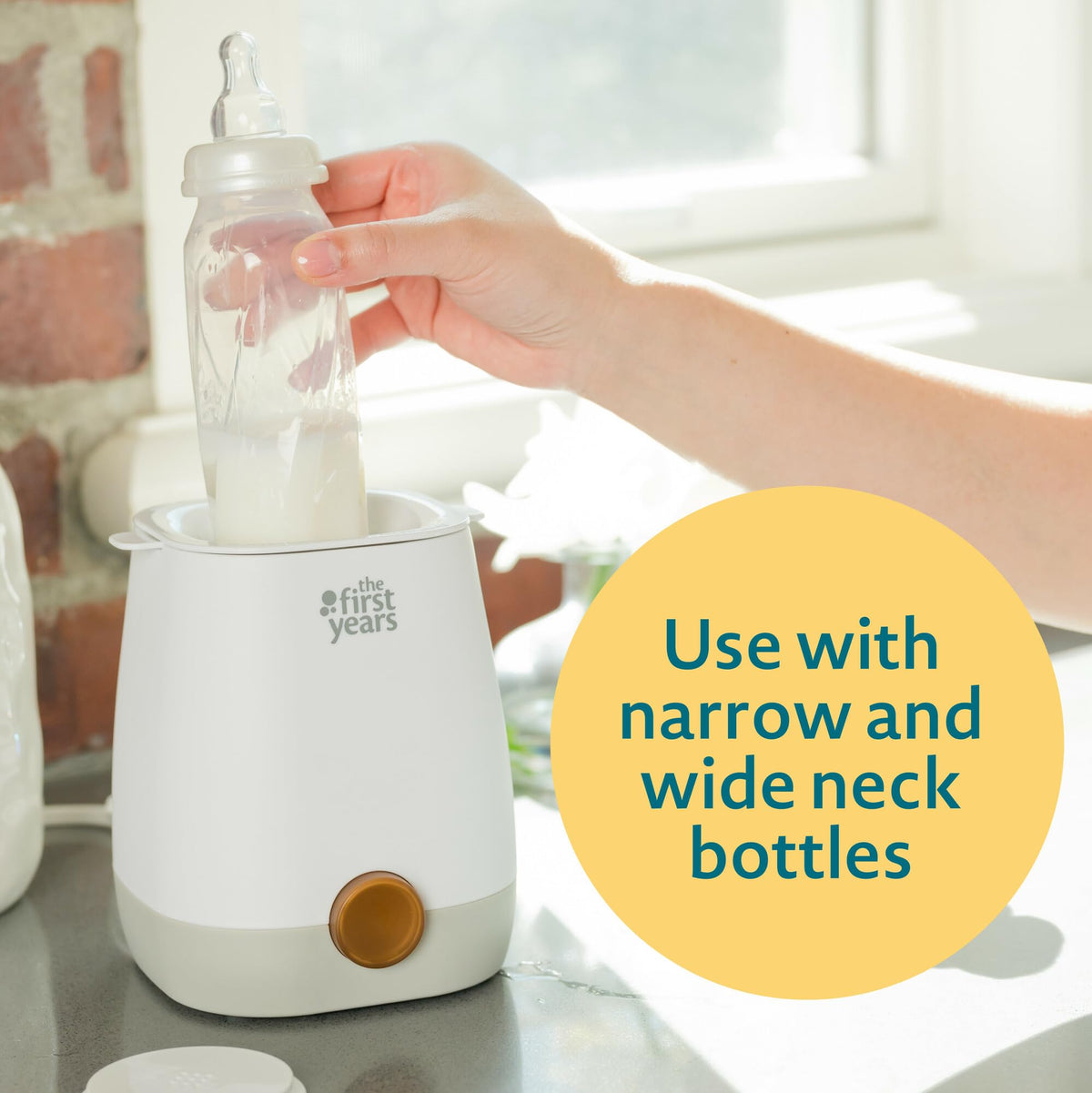 Complete packaging and accessories included with The First Years bottle warmer