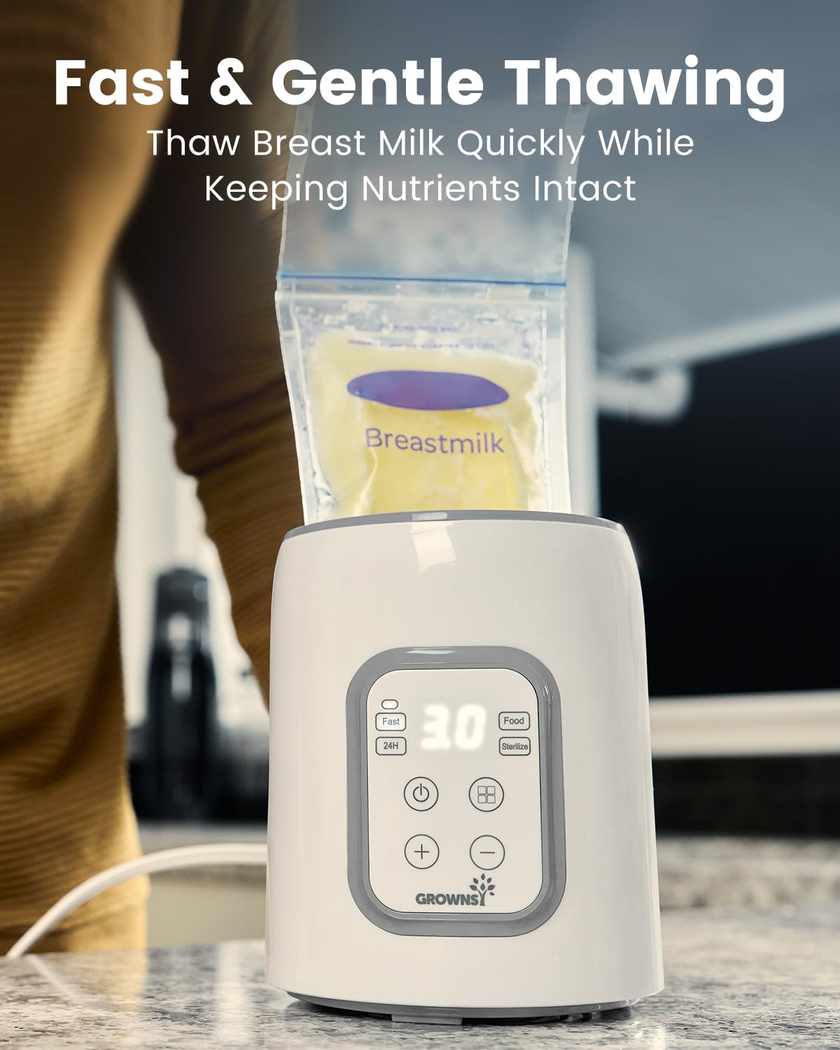 Grownsy 8-in-1 device performing steam sterilization for baby bottles