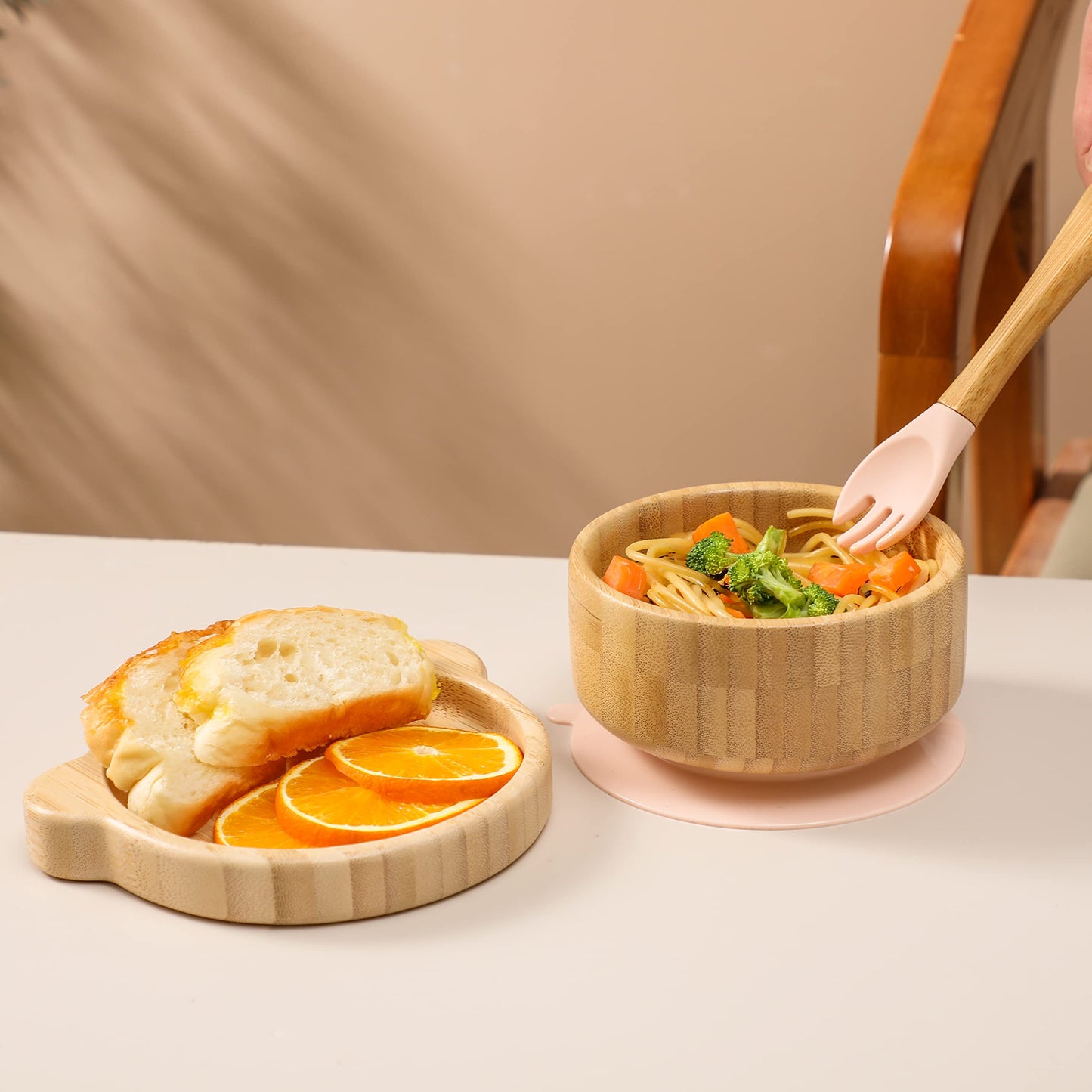 Detachable silicone suction base on pink bamboo baby bowl