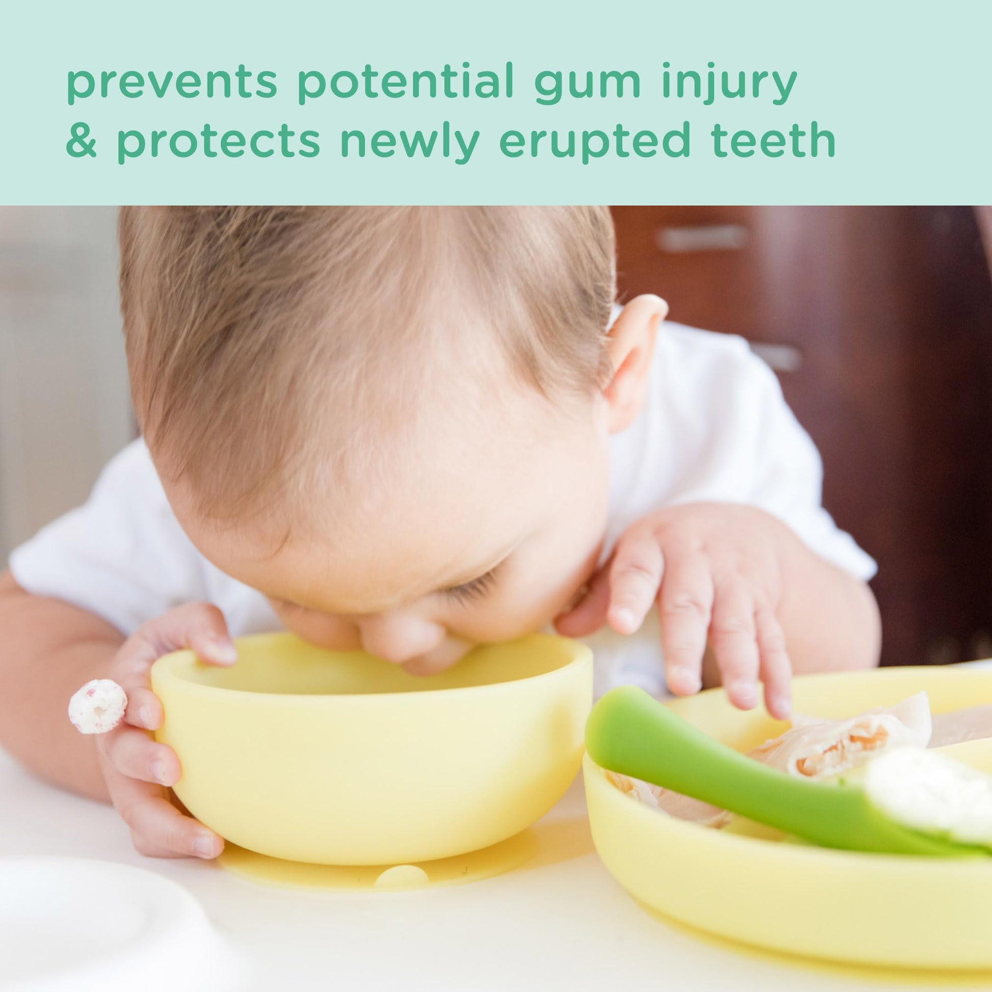 Toddler using Olababy silicone bowl for baby led weaning