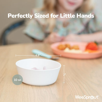 Four colorful pastel kids bowls stacked together