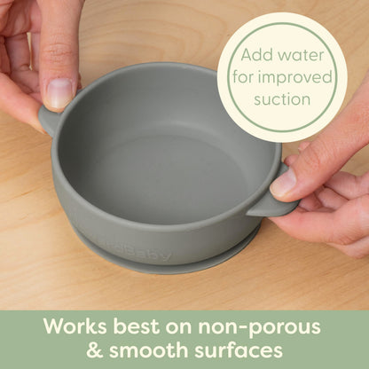 Toddler using UpwardBaby easy grip silicone spoon for self feeding