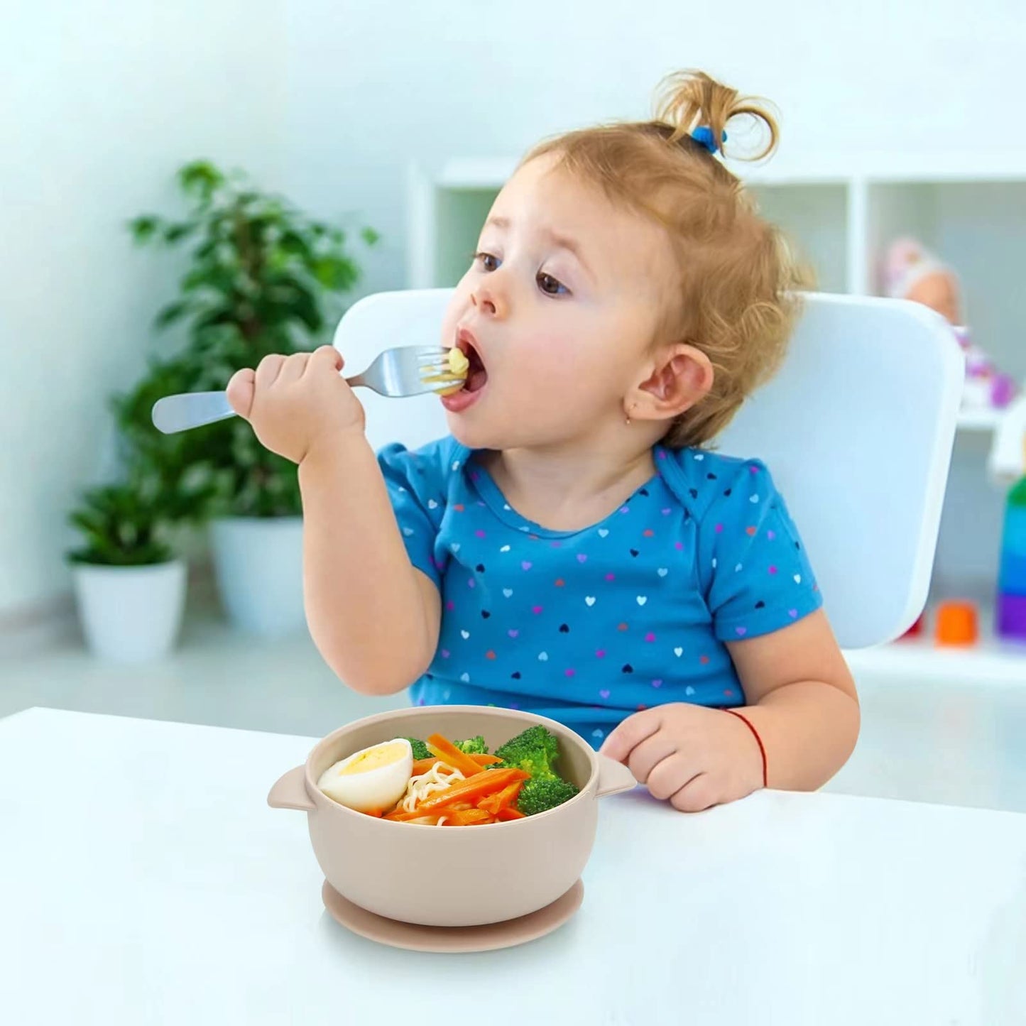 Three colorful silicone baby bowls with suction base