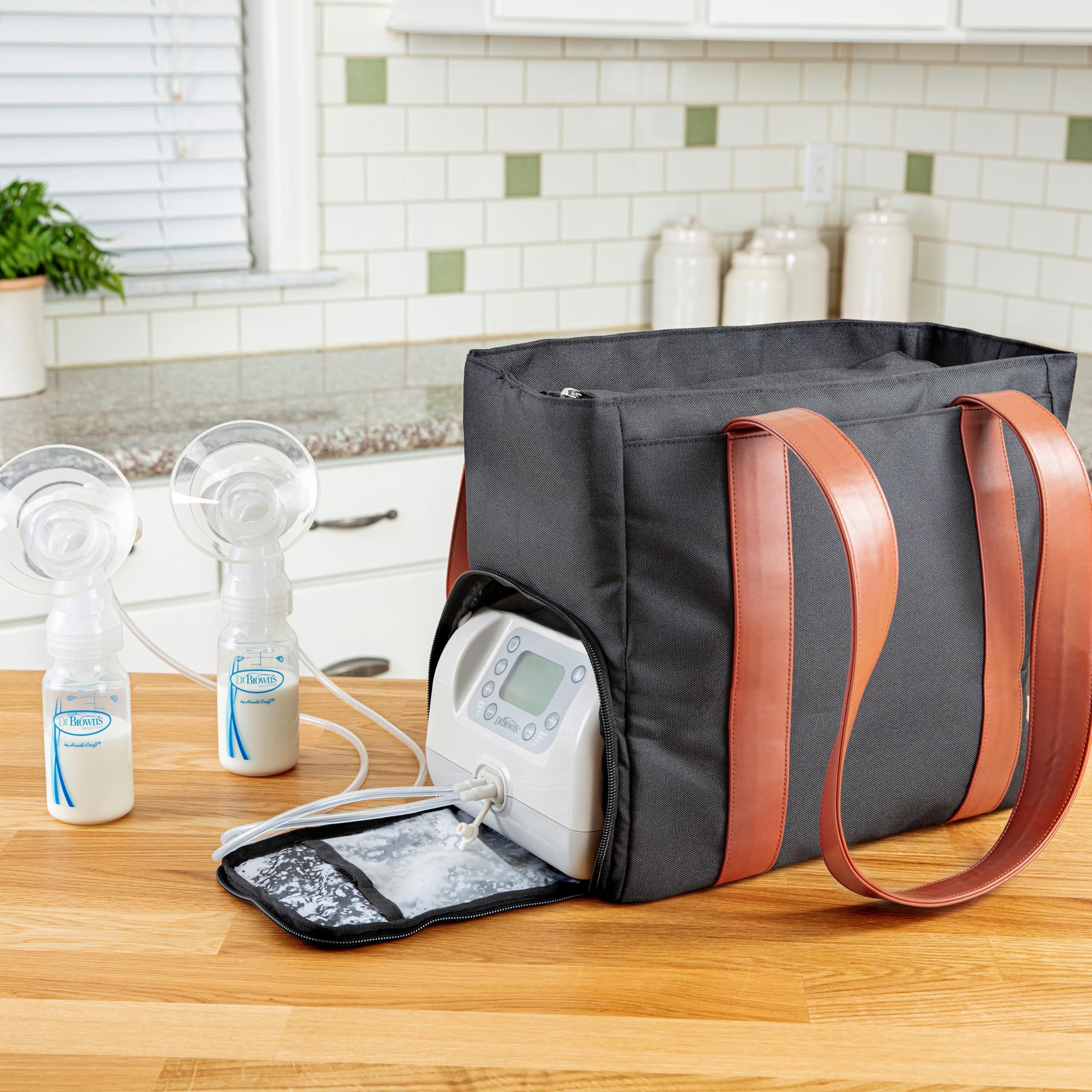 Dr. Brown's breast pump travel carrier showing side pocket for water bottle placement