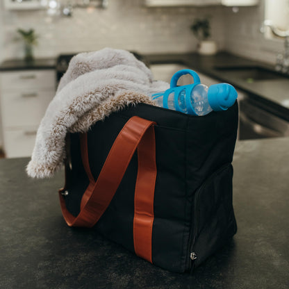 Dr. Brown's portable nursing bag detailing the reinforced stitching and black trim borders