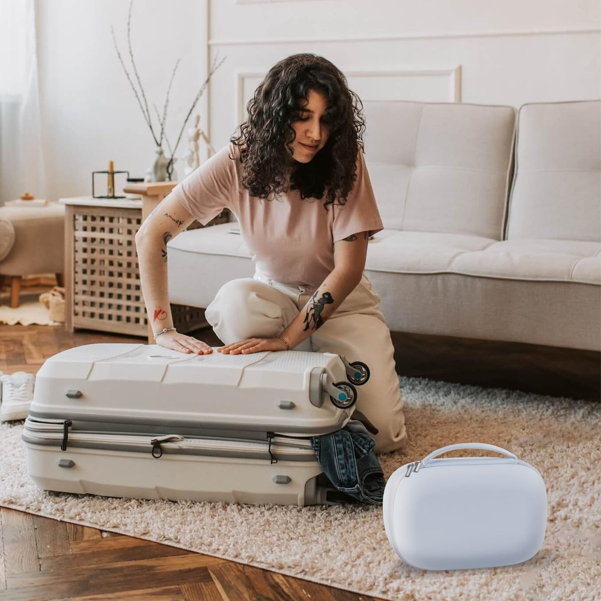 Lifestyle view of the Gowing white electronic breast pump case being placed into a mother's travel diaper bag.
