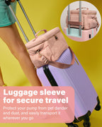 Flyangle EliteMom utility diaper tote demonstrating the rear luggage sleeve attached to a rolling suitcase handle.