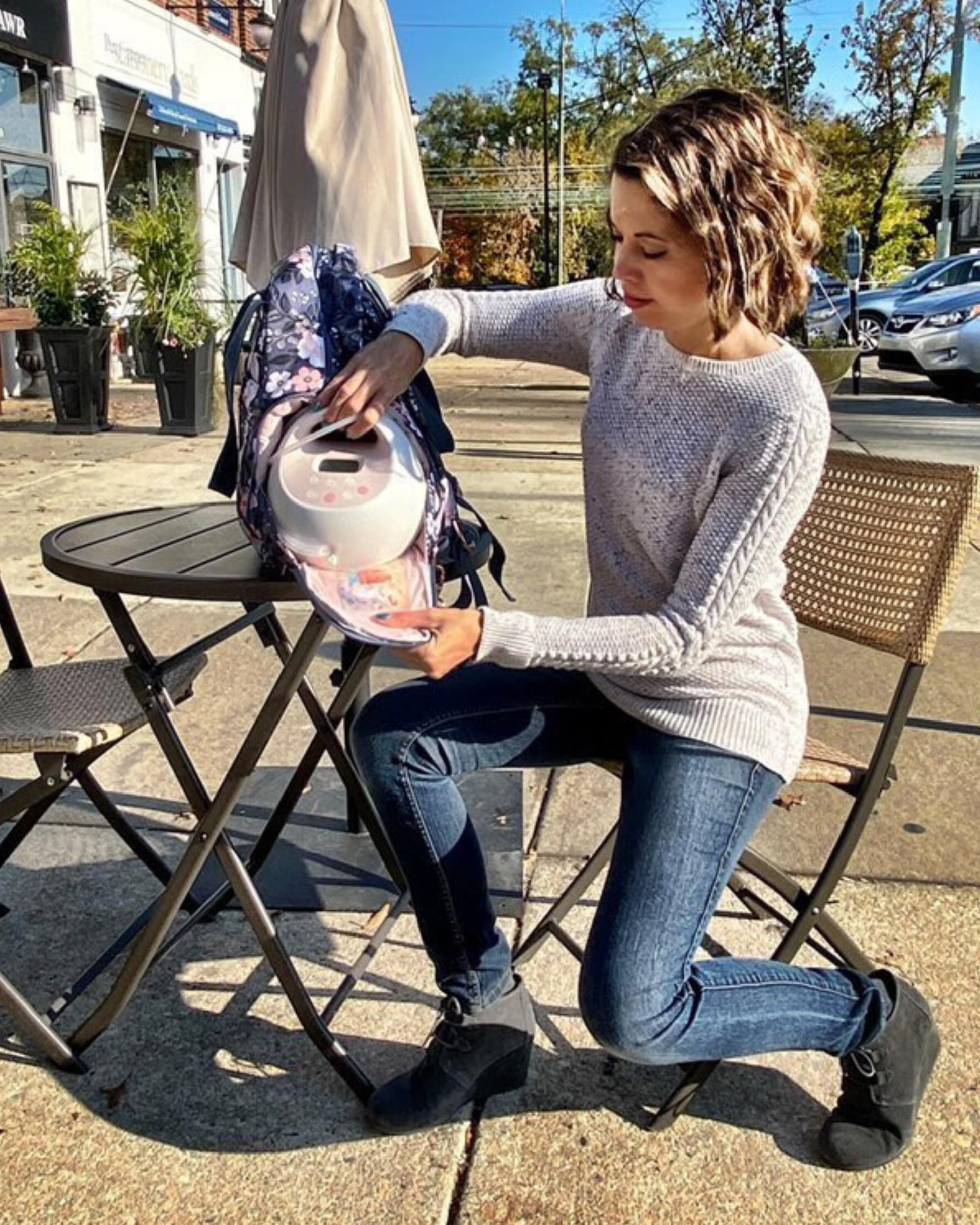 Sarah Wells Kelly Le Floral backpack side view showing water bottle pocket