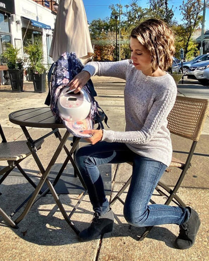 Sarah Wells Kelly Le Floral backpack side view showing water bottle pocket