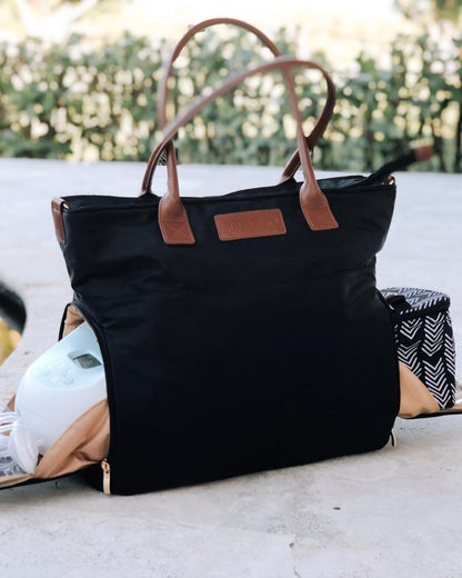 Sarah Wells Abby Tote showcasing the insulated side pocket holding a portable breast pump