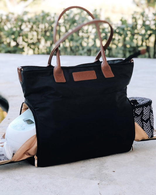 Sarah Wells Abby Tote showcasing the insulated side pocket holding a portable breast pump