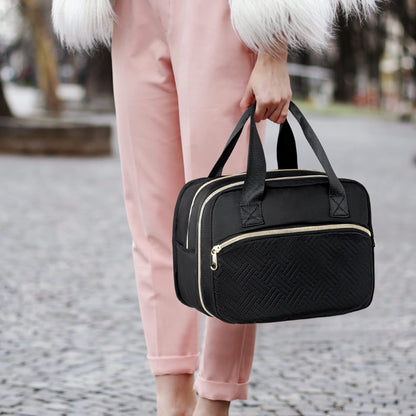 Fasrom premium nursing mother bag being carried by the top handle in a professional office setting.