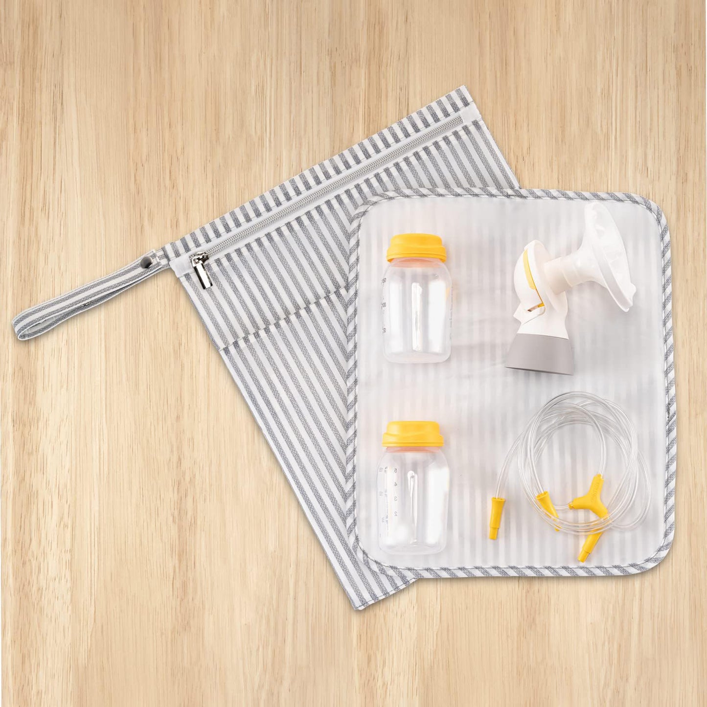 Waterproof internal compartment of BABEYER nursing bag containing baby bottles and pump shields