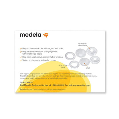 Side profile of Medela breast shells inside a nursing bra