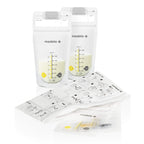 Medela breast milk bottles with yellow lids and storage tray