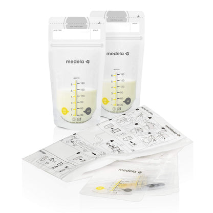 Medela breast milk bottles with yellow lids and storage tray