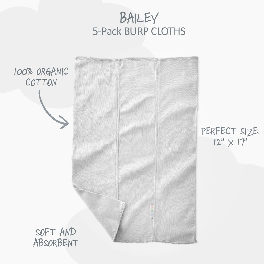 Five pieces of white baby burp cloths neatly folded highlighting the GOTS-certified knit weave.
