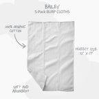 Five pieces of white baby burp cloths neatly folded highlighting the GOTS-certified knit weave.