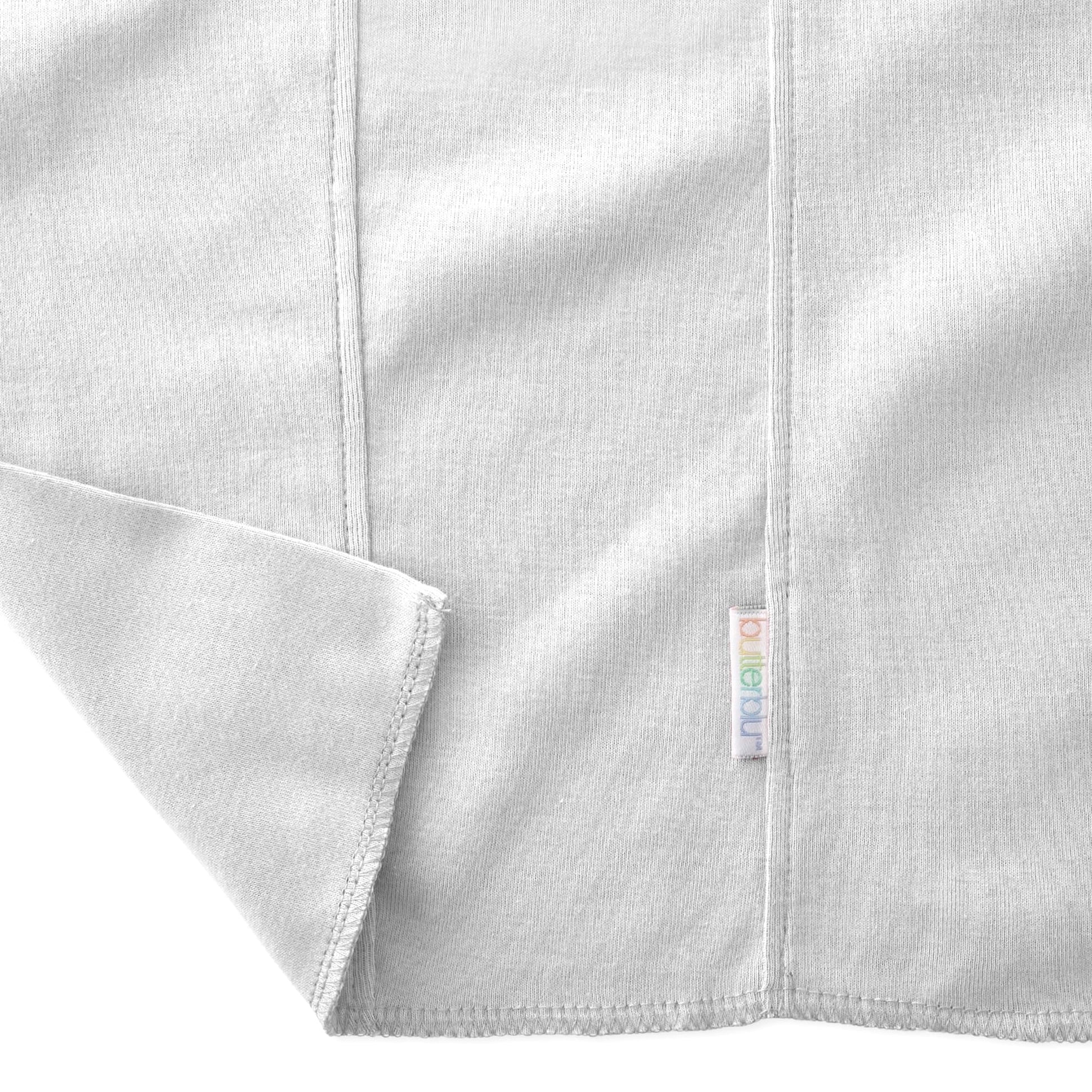 Close-up shot of the hypoallergenic organic cotton fabric gentle on newborn skin.