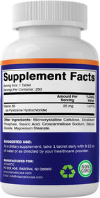 Vitamatic Vitamin B6 bottle next to water glass