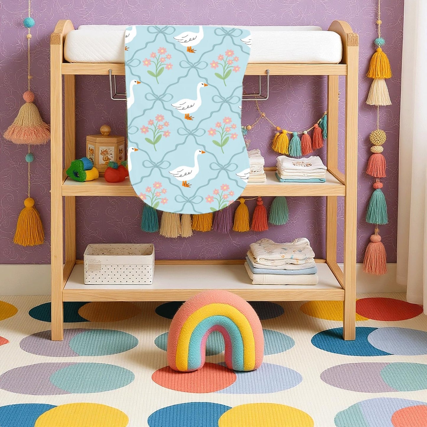 Wauprant gender neutral blue tones baby washcloths being used as a portable changing mat under an infant.