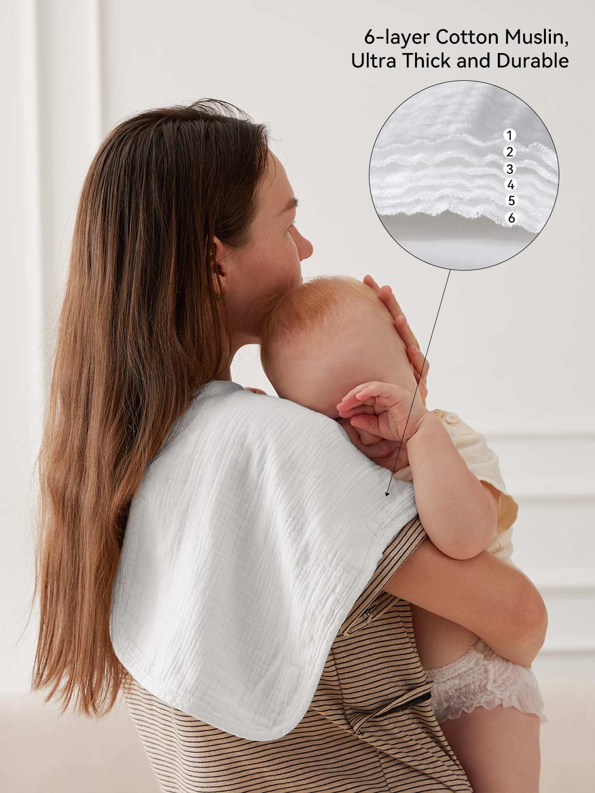 White gender neutral baby burp cloths stacked neatly for nursery organization