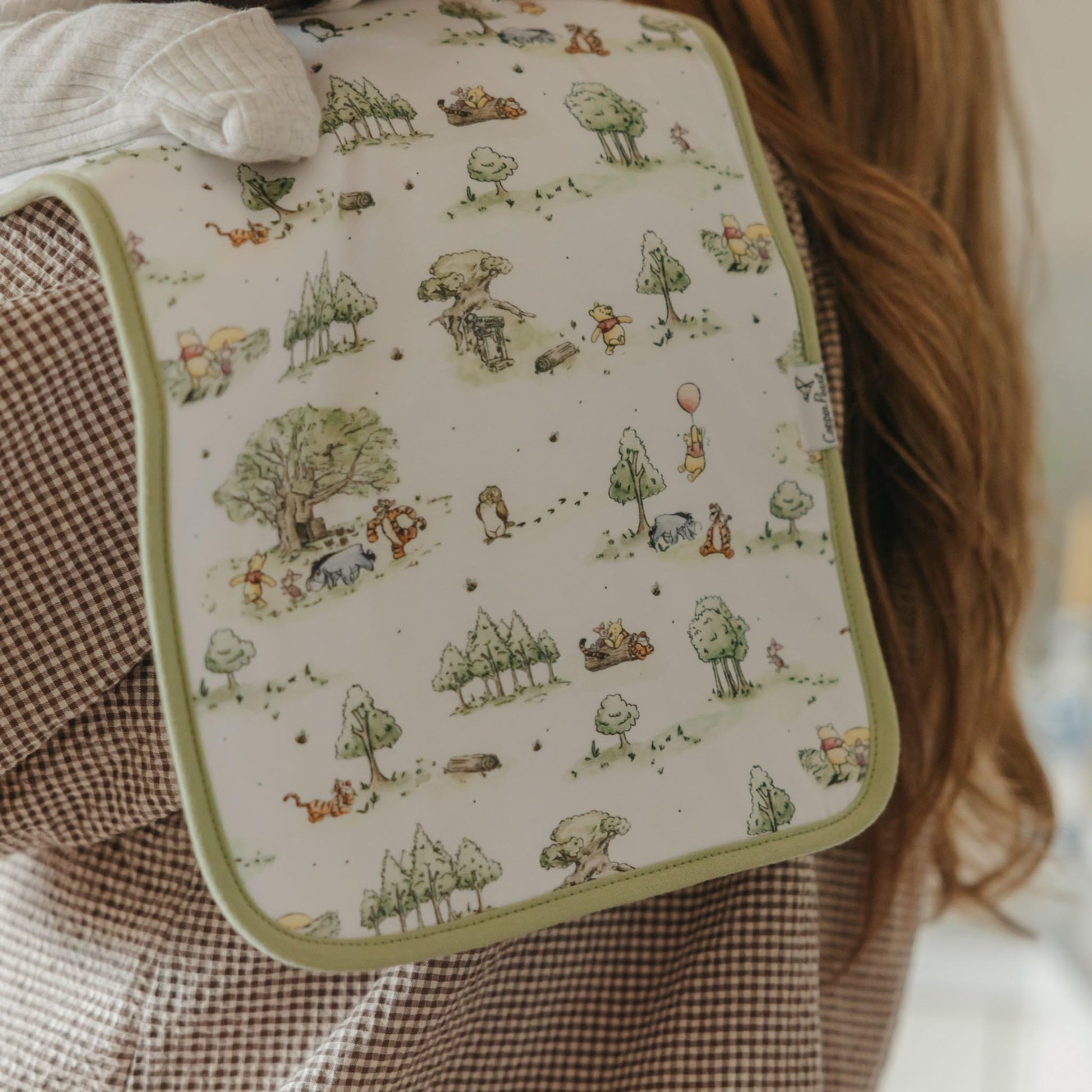 Copper Pearl Hundred Acre Wood burp cloths spread out displaying the oversized dimensions.
