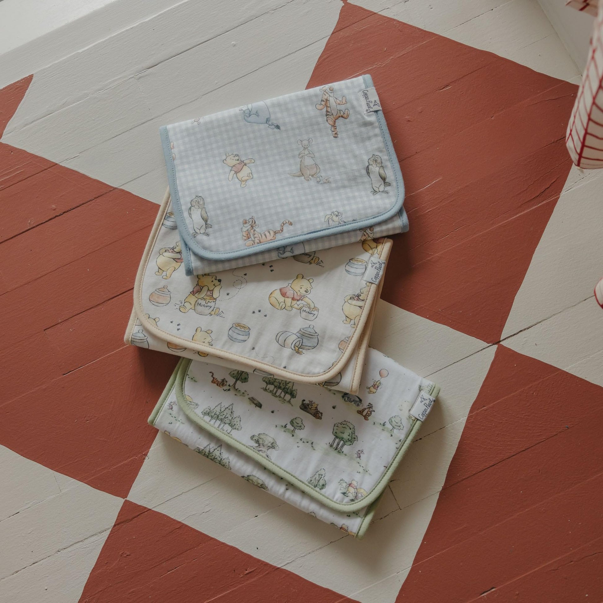 Copper Pearl luxury newborn burp cloth collection displaying full shoulder coverage layout.