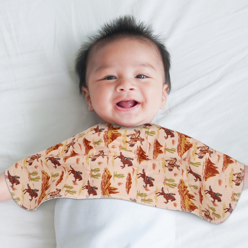 Windkream baby burp cloths being used on shoulder