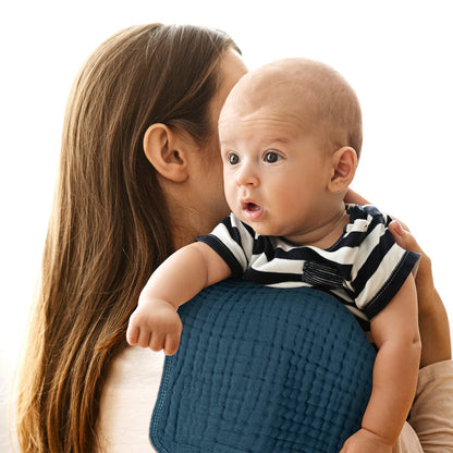 Neutral light colored muslin bibs and cloths set