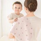 Susurration 100 percent cotton baby washcloths folded neatly showing fabric texture.