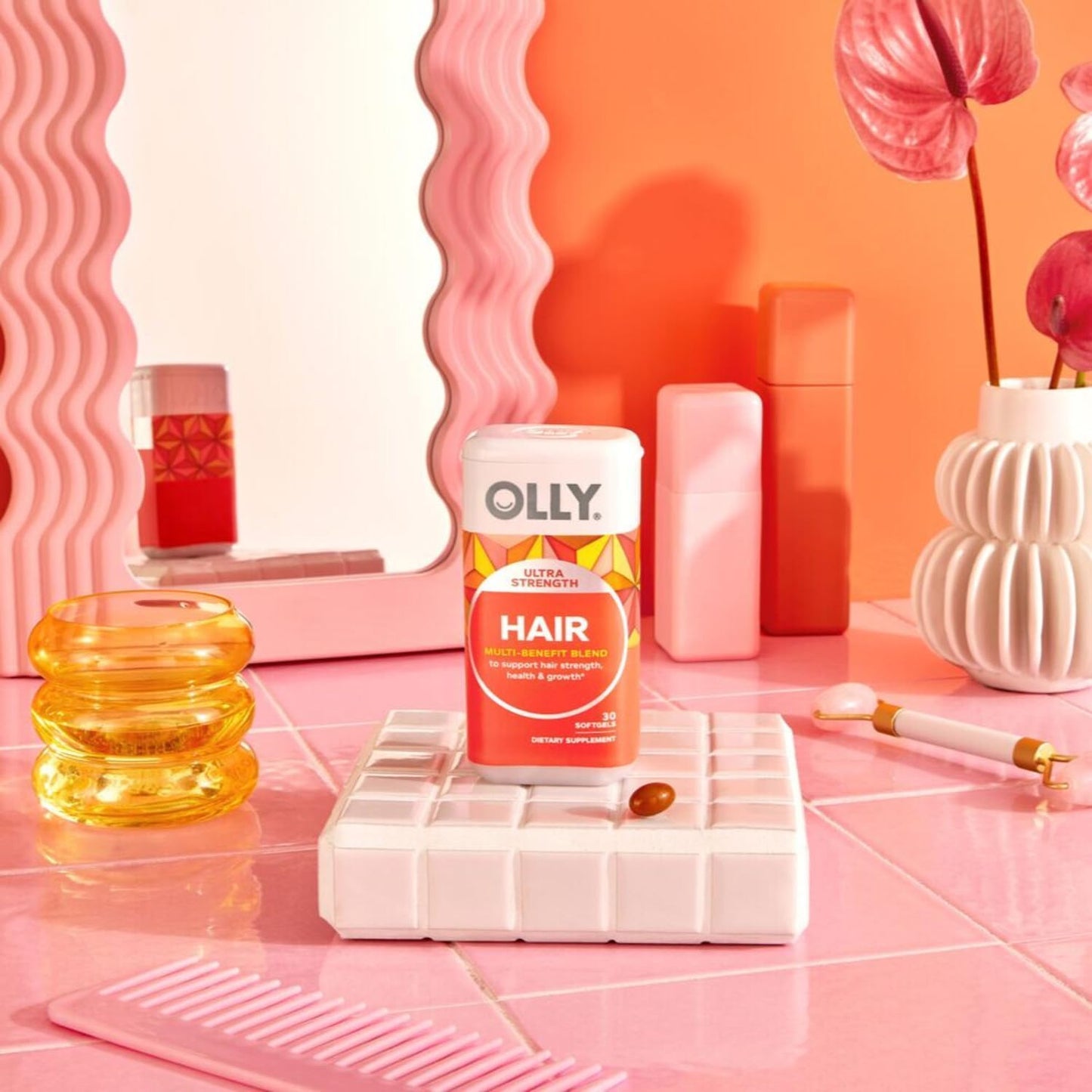 Close up view of OLLY hair health softgels containing Amla extract and Silicon.