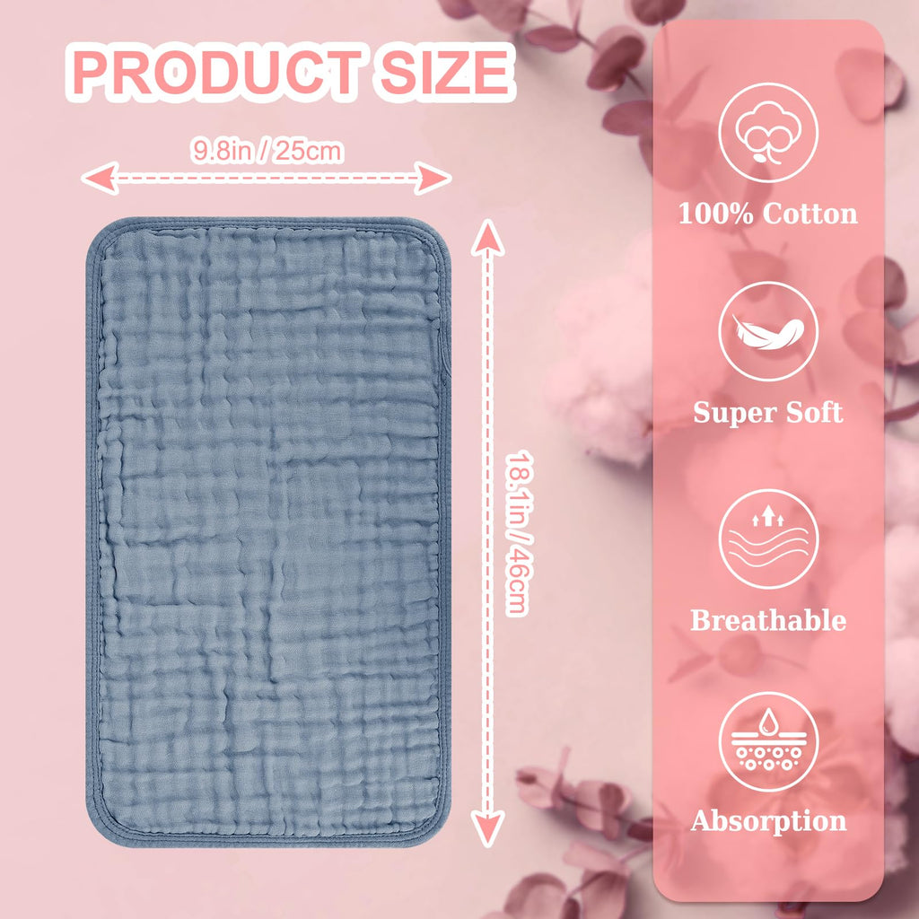 Unisex white and pastel shaded baby burping cloths stacked together neatly
