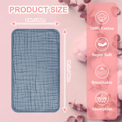 Unisex white and pastel shaded baby burping cloths stacked together neatly